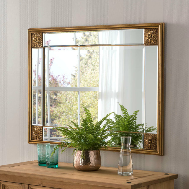  ELEGANCE GOLD MIRROR €215.00 - €375.00  Rectangular gold leaf mirror with embellished corners and top and side strip bevel mirrors is a stunning example of a contemporary wall mirror.The mirror is traditionally hung landscape and is perfect for creating a focal point within your current living space.The mirror is simple yet elegant and offers a sophisticated feel to your current home design.The Elegance range is one of our most popular rectangle mirrors and is also available in ivory and silver.